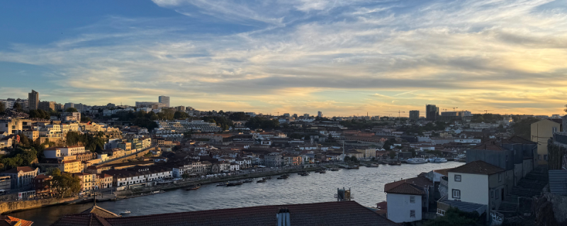 Cloud patterns over an old-world city near sunset